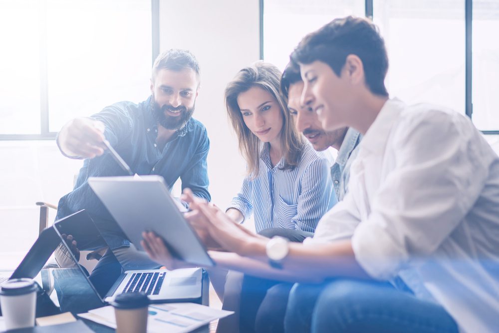 Group of office workers working together