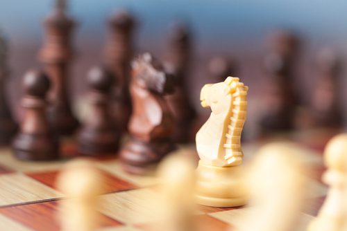 Introhive | Two Chess Pieces Facing Off 1 | CRM vs. Marketing Automation: Do You Really Need Both?