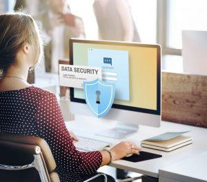 Office worker at secured computer