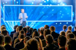 People watching a conference speaker