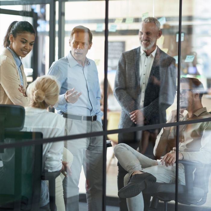 Post M&A, professionals at a large firm discuss resource allocation