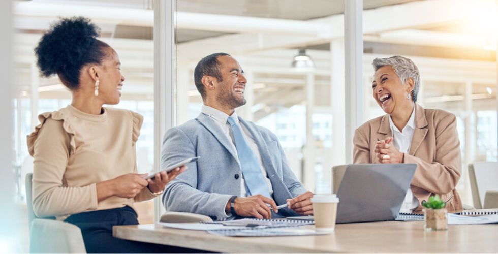 Professionals collaborating on client data and strategy to drive a successful M&A.