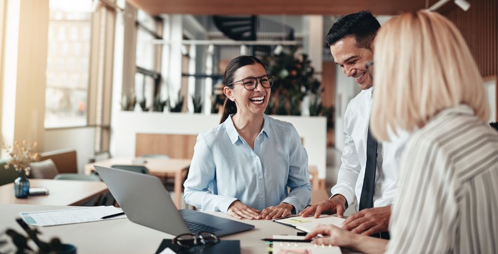 Business development team at a law firm discussing relationship management strategies, including alumni tracking, while evaluating CRM for law firms solutions