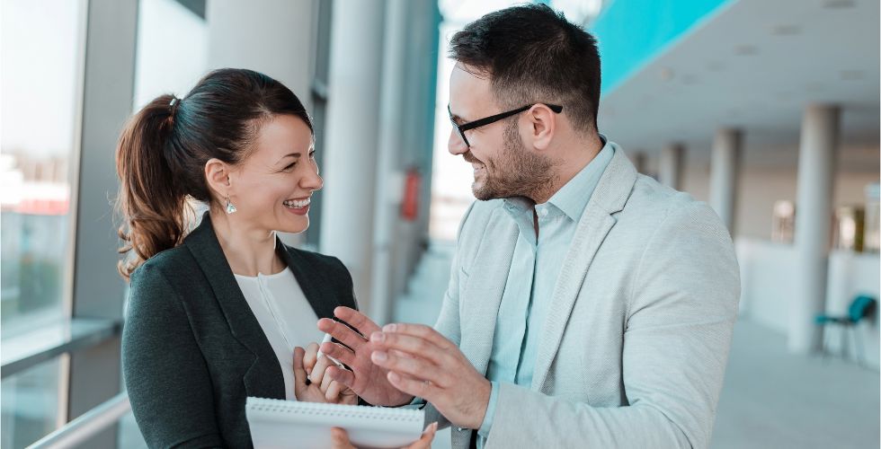 Professionals at a mid-market accounting firm discussing their digital transformation accounting strategy.