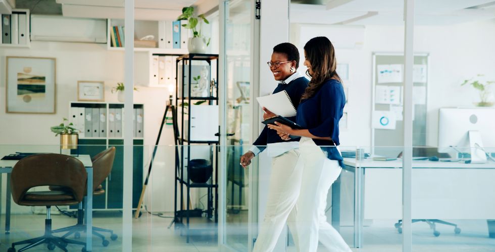 A partner and a marketing leader discussing their firm’s business transformation strategy and how they’ll use relationship intelligence to activate their network of relationships to ensure growth and successful ROI from their transformation.