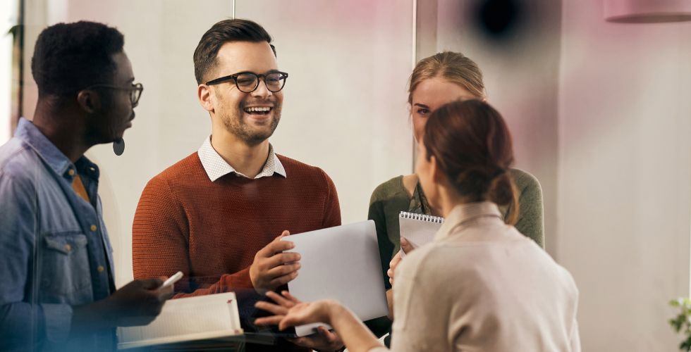 Young professionals collaborating in an office setting, reflecting a new generation shaping accounting firm growth strategy through culture, client relationships, and shared responsibility.