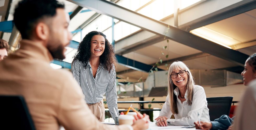 Legal marketing strategies in practice as a cross-functional team collaborates around a table, aligning relationship insights to drive more focused outreach, stronger client relationships, and business development outcomes.